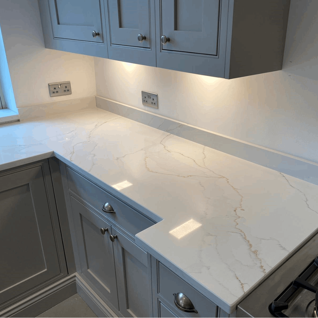 Calacatta Platinum quartz kitchen worktops with a white background which is enhanced by grey and gold veining.