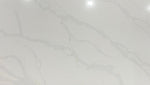 Calacatta Platinum quartz slab with a white background which is enhanced by grey and gold veining.