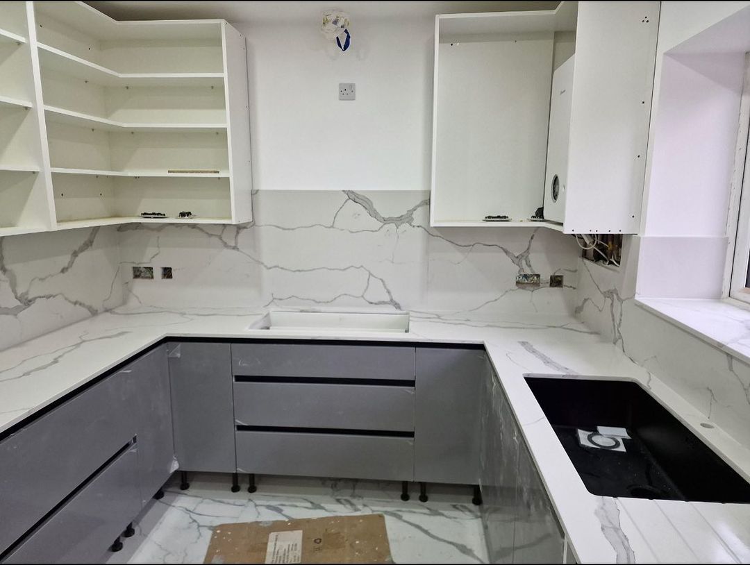 Calacatta Tuscan kitchen worktops with a white marble effect quartz with a striking grey vein.
