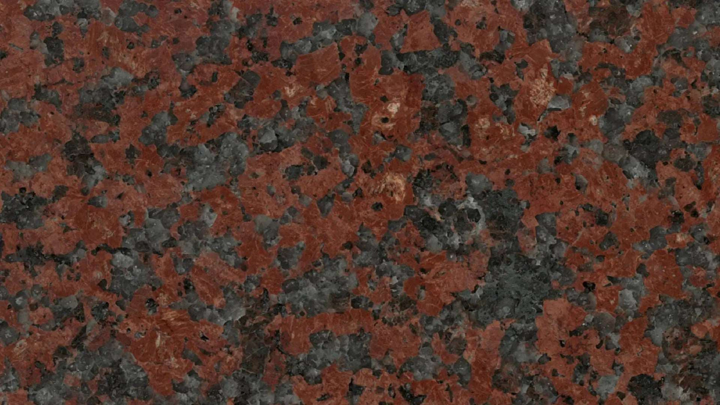 Red uniformly speckled granite with a medium grain size.