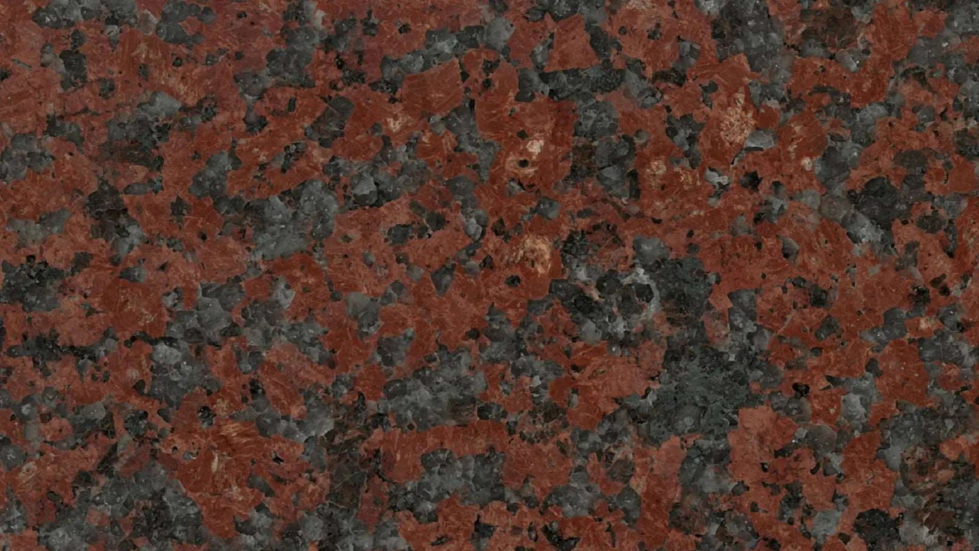 Red uniformly speckled granite with a medium grain size.