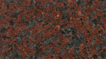 Red uniformly speckled granite with a medium grain size.