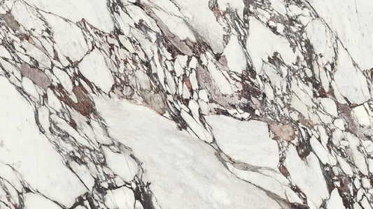 Uniceramica Calacatta Viola Ceramic slabs with white-creamy base-colour and darker grey-violet veins spread over the surface.