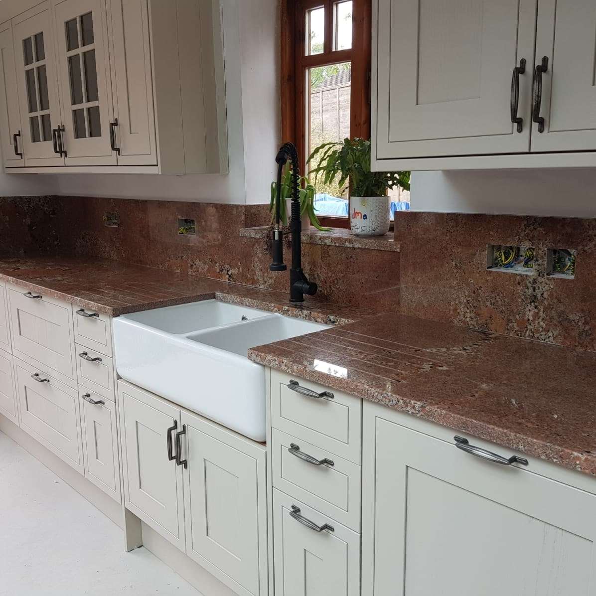 Bordeaux Granite Kitchen Worktops with Cream Cabinetry