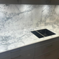 Eclipsia quartz worktop with a kitchen sink in a modern kitchen setting