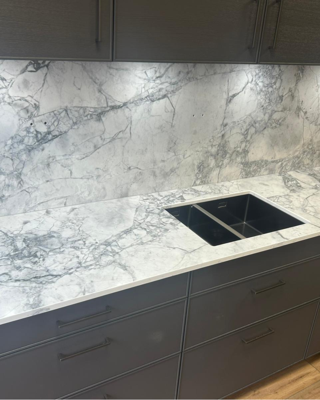 Eclipsia quartz worktop with a kitchen sink in a modern kitchen setting