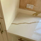 Calacatta Aurous quartz kitchen worktops with a cool white base with vivid gold and subtle grey veining intermixed elegantly.