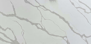 Calacatta Light quartz slab with a light background adorned by a combination of thin and thick grey veins.
