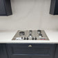 Calacatta gold quartz kitchen worktops with grey veins married with delicate gold veins throughout the slab on a white background.