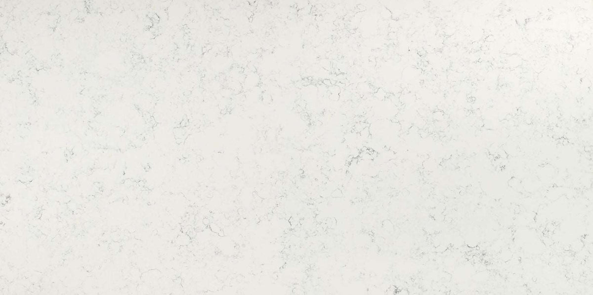 Carrara White quartz slab with a soft white hue and smoky grey veins.