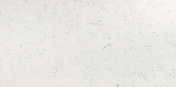 Carrara White quartz slab with a soft white hue and smoky grey veins.