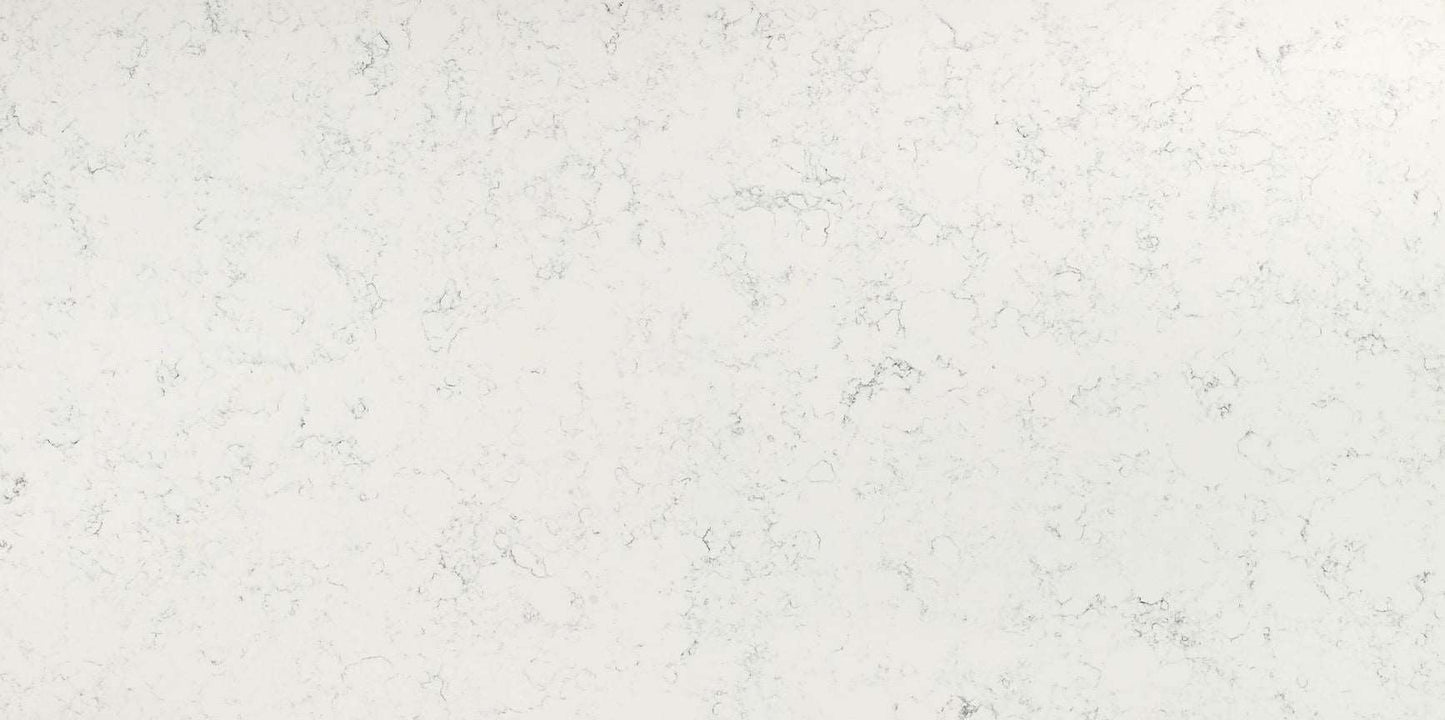 Carrara White quartz slab with a soft white hue and smoky grey veins.