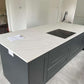 Fugen Calacatta Oro marble effect Quartz kitchen worktops with soft grey veining and gold veins running through it.