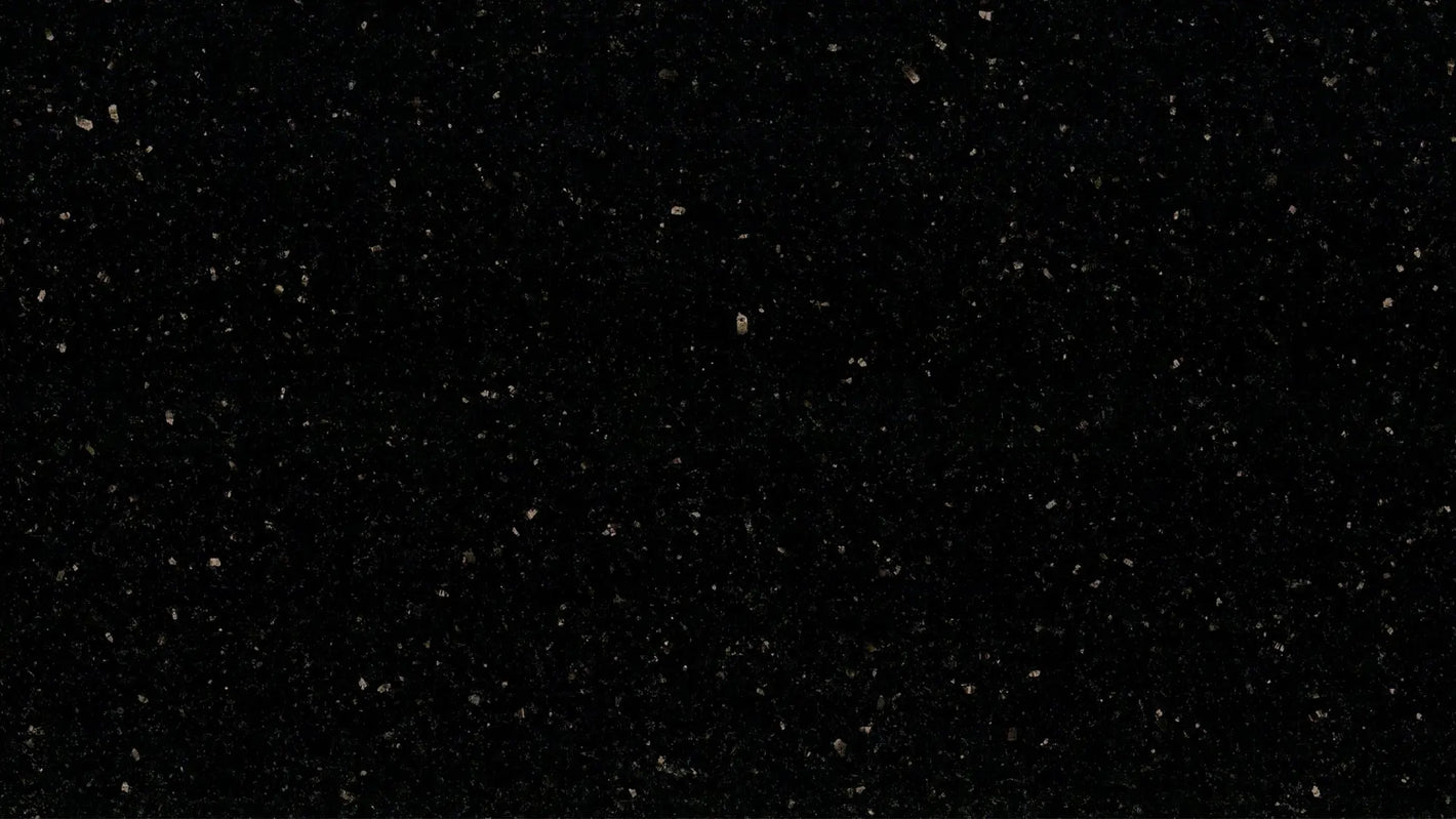 Star Galaxy granite slab, Black, speckled medium coarse grained granite with scattered yellow / gold shiny speckles.