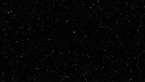 Star Galaxy granite slab, Black, speckled medium coarse grained granite with scattered yellow / gold shiny speckles.