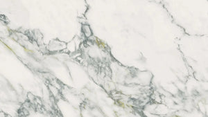 Uniceramica Arabescato Calacatta Ceramic slabs with white base-colour and darker grey veins spread over the surface.