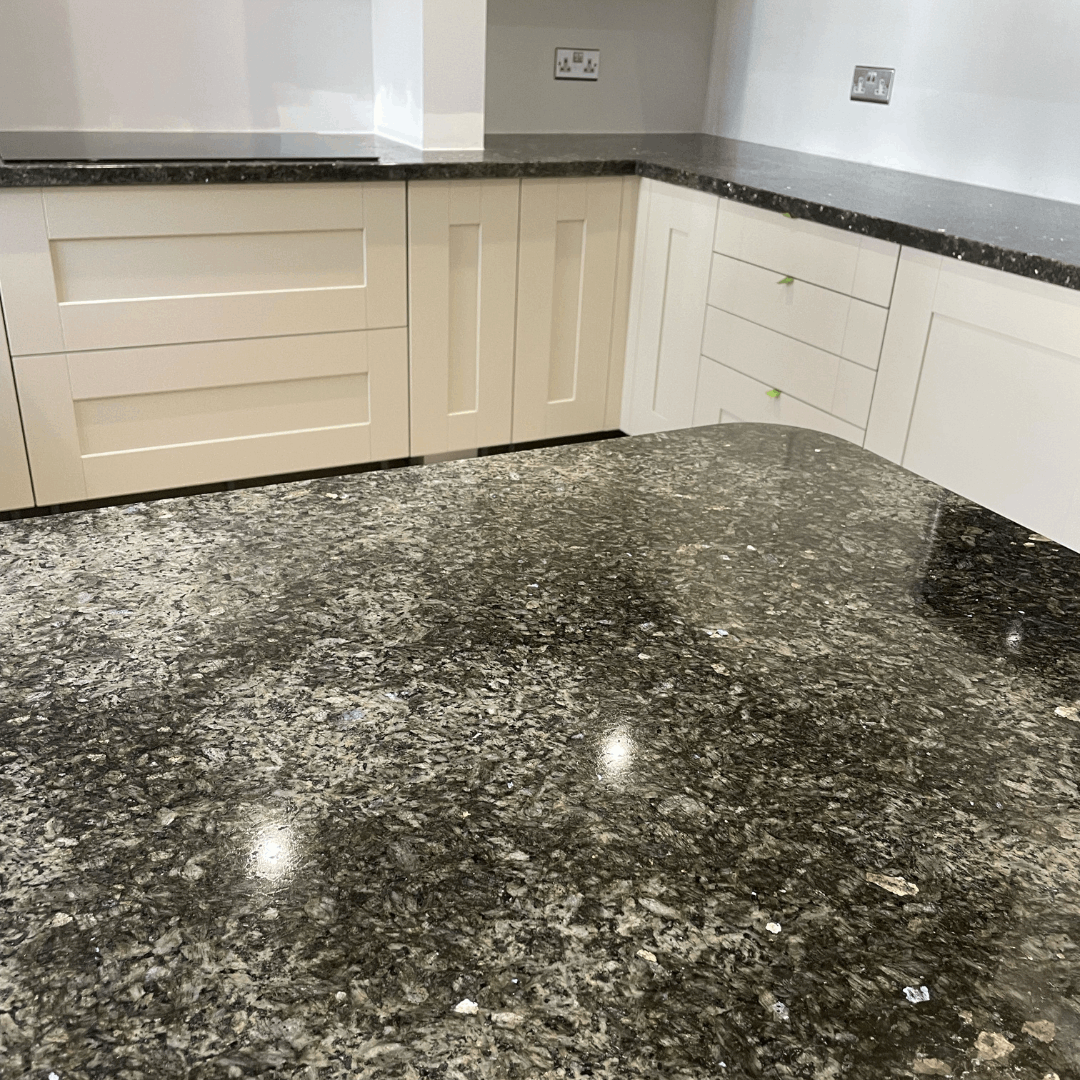 Nordlys Granite Kitchen Worktops with Cream Cabinetry