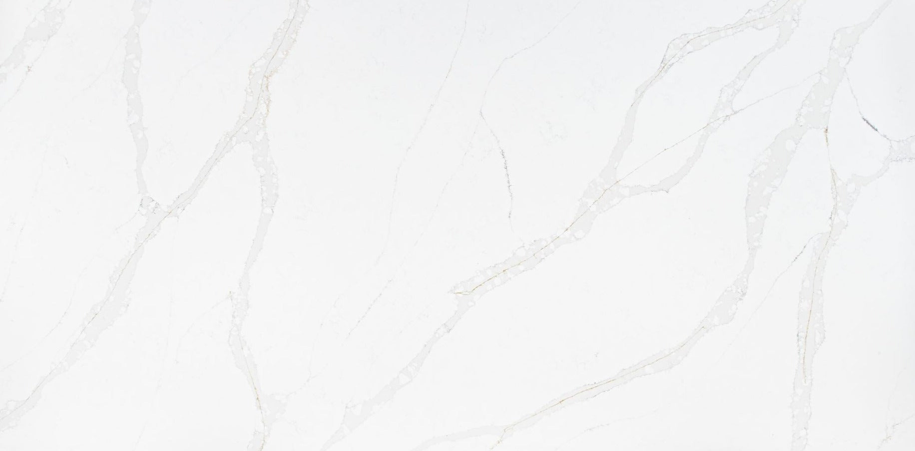 Calacatta gold quartz slab with grey veins married with delicate gold veins throughout the slab. 