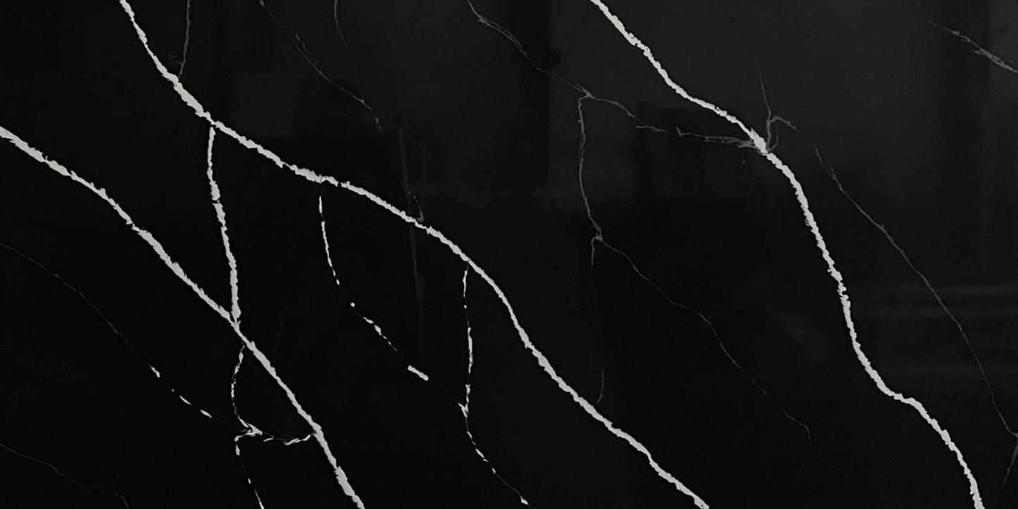 Black Marquina quartz slab, black marble-look quartz with white veining.