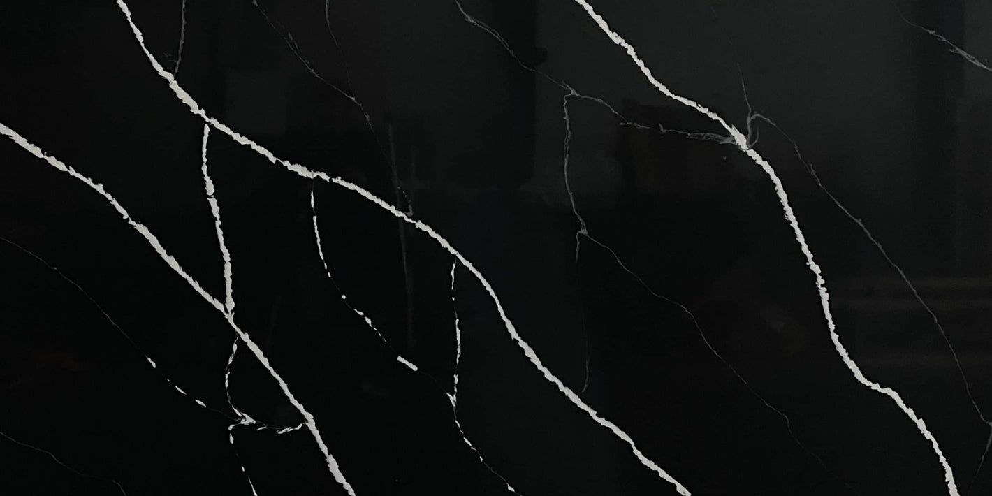 Black Marquina quartz slab, black marble-look quartz with white veining.