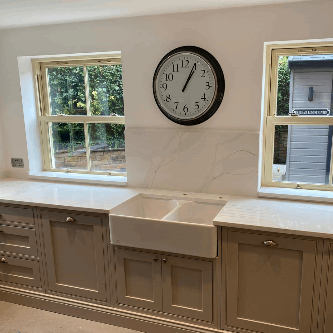 Calacatta Platinum quartz kitchen worktops with a white background which is enhanced by grey and gold veining.