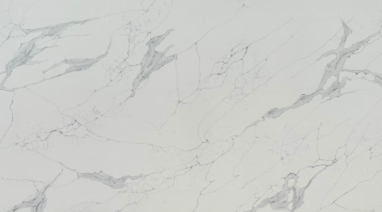 Venetian River quartz slab with a white background with a mix of thin and thick marble veining.