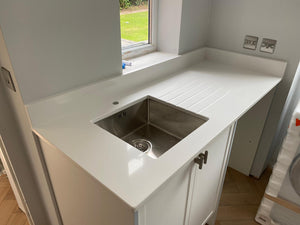 Worldwide Stones Super White Quartz kitchen worktop with drainer grooves