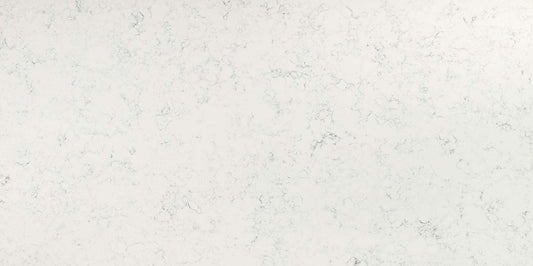 Carrara White quartz slab with a soft white hue and smoky grey veins.