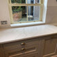Calacatta Platinum quartz kitchen worktops with a white background which is enhanced by grey and gold veining.