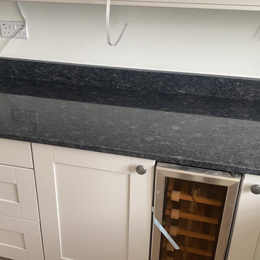 Steel Grey Granite Kitchen Worktops with white cabinetry